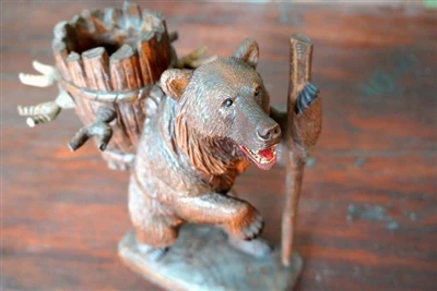 The importance of carving bear wine racks in the Black Forest is self-evident