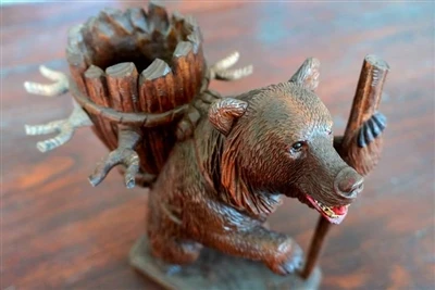 The significance of collecting black forest carved bear wine racks